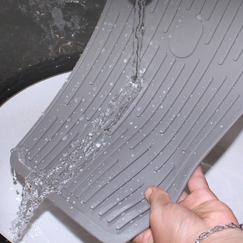 Rektangulær knap til at holde afløbspuden