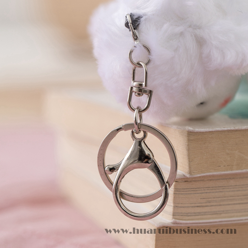 Hvid lamme plys- og plysdybelring/fyld legetøjsnøglering