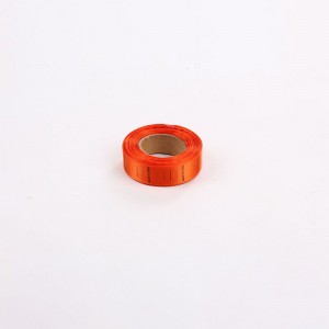 Farverige vævet beklædningsmærke